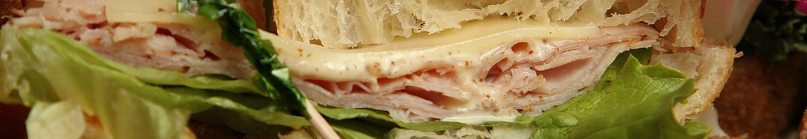 Eating Deli Sandwich at Sam's Sandwiches & Coffee restaurant in Daly City, CA.